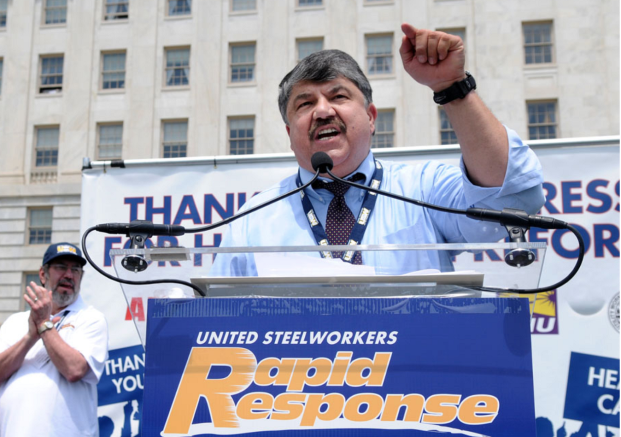 Photo of Richard Trumka, President of the AFL-CIO, at a podium outside speaking