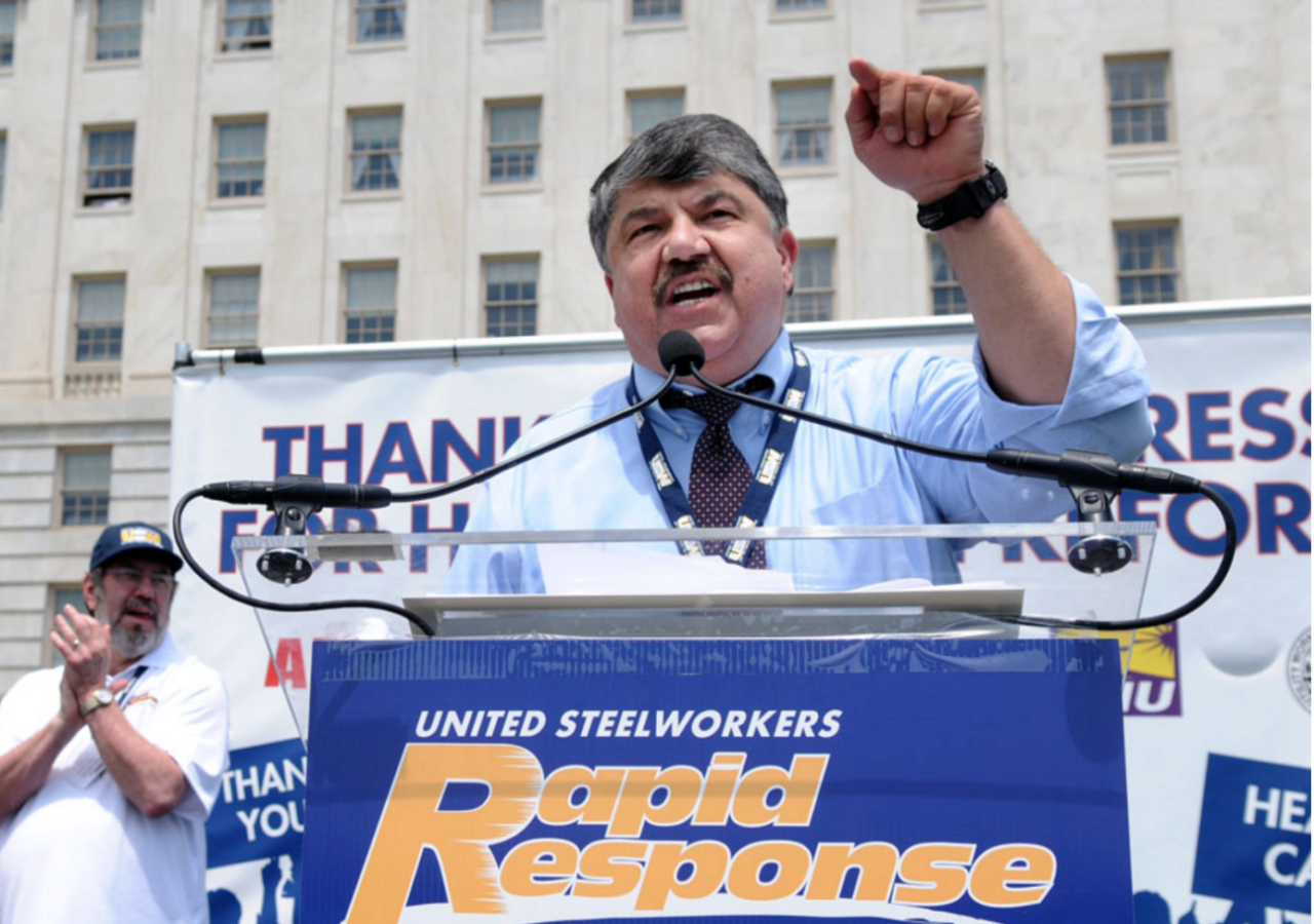 Photo of Richard Trumka, President of the AFL-CIO, at a podium outside speaking