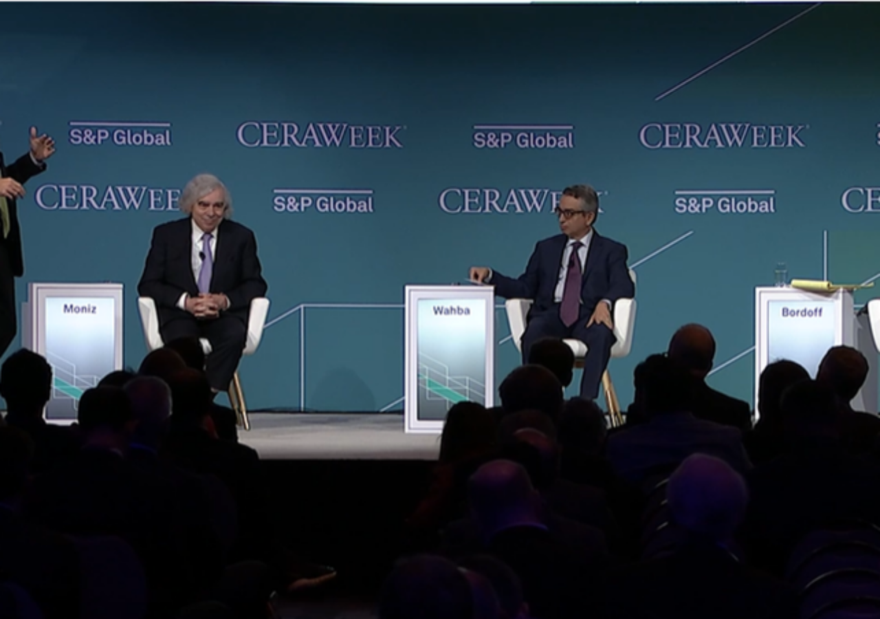 EFI Foundation CEO Ernest Moniz sits on a panel at CERAWeek 2023 with moderator and other panelists.